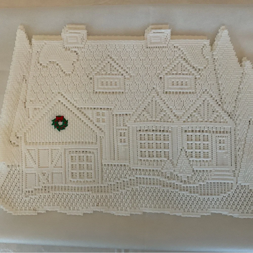 White Holiday House Lace placemats and runner.